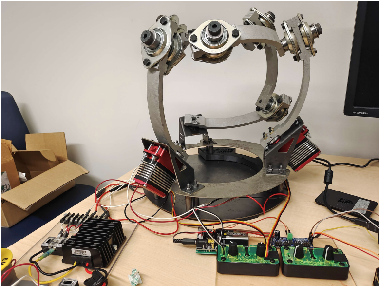 The rebuilt spherical parallel manipulator with its three servos, power board and potentiometer controllers